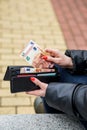 Woman hands taking money out of black leather purse Royalty Free Stock Photo