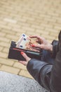 Woman hands taking money out of black leather purse Royalty Free Stock Photo