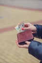 Woman hands taking money out of brown leather wallet Royalty Free Stock Photo