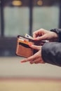 Woman hands taking money out of leather wallet Royalty Free Stock Photo