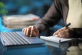 Woman hands taking notes using laptop in the night Royalty Free Stock Photo