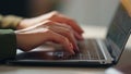 Woman hands texting laptop keyboard closeup. Unknown busy businesswoman emailing