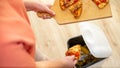 Woman hands throwing food into the trash, bin, waste of food, food concept