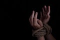 Woman with hands tied with rope, concept of violence, woman& x27;s rights. copy space for text