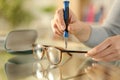 Woman hands tightening screw on glasses with screwdriver