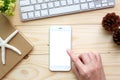 Woman hands touching empty white screen of smartphone