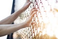 Woman hands touching a metal fence wire Royalty Free Stock Photo