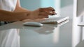 Woman hands typing computer keyboard closeup. Unknown manager writing email Royalty Free Stock Photo