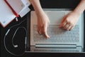 Woman hands typing on the keyboard