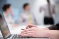 Woman hands typing on laptop keyboard at business meeting Royalty Free Stock Photo