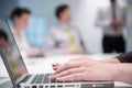 Woman hands typing on laptop keyboard at business meeting Royalty Free Stock Photo