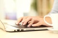 Woman hands typing on laptop keyboard at home Royalty Free Stock Photo