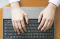 Woman hands typing on laptop keyboard