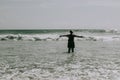 Woman is hands up on sea beach. Raised outstretched arms Royalty Free Stock Photo