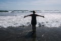 Woman is hands up on sea beach. Raised outstretched arms Royalty Free Stock Photo