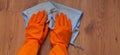 A woman hands Using blue rags wipe the wooden floor Royalty Free Stock Photo