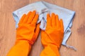 A woman hands Using blue rags wipe the wooden floor Royalty Free Stock Photo