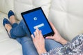 Woman Hands using iPad pro with Facebook homepage on monitor screen. Facebook the biggest social network website. Homepage Royalty Free Stock Photo