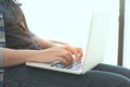 Woman hands using laptop for working.