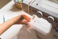 Woman hands using sewing machine Royalty Free Stock Photo