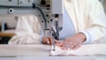 Woman hands using sewing machine Royalty Free Stock Photo