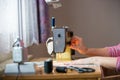 Woman hands using sewing machine on a sewing manufacture, sewing process Royalty Free Stock Photo