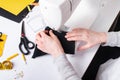 Woman hands using a sewing machine to sew a black face mask during the coronavirus pandemia. Royalty Free Stock Photo