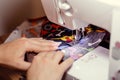 Woman hands using the sewing machine Royalty Free Stock Photo