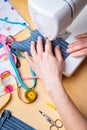 Woman hands using the sewing machine to sew the face mask during the coronavirus pandemia. Domestic sewing due to the shortage of Royalty Free Stock Photo