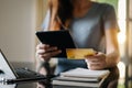 Woman hands using smartphone and holding credit card with digital layer  as Online shopping concept Royalty Free Stock Photo