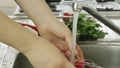 Woman washin vegetables