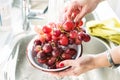 Woman hands washing grapes Royalty Free Stock Photo