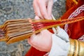 Woman hands weaving traditional belt