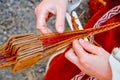 Woman hands weaving traditional belt