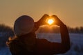 Woman hands in winter gloves. Heart symbol shaped, lifestyle and Royalty Free Stock Photo