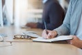 Woman, hands and writing in book for business tasks, reminder or schedule at the office desk. Hand of female taking Royalty Free Stock Photo