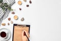 A woman hands writing on empty book note, diary, spread mockup, top view, studio. Cup of coffee break. Royalty Free Stock Photo