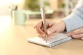 Woman hands writing on notebook at home Royalty Free Stock Photo