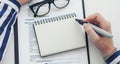 Woman hands writing in an opened book or notebook, top view flat lay. Mock up design Royalty Free Stock Photo