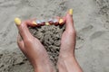 Summer Vibes: Woman\'s Hands Embracing Beach Sand