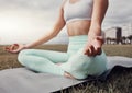 Woman, hands and yoga meditation in the city for spiritual wellness, mind and body on mat. Hand of calm female yogi in Royalty Free Stock Photo