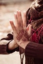 Woman hands in yoga namaste mudra gesture  with henna drowing on hands outdoor shot Royalty Free Stock Photo