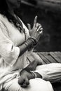 Woman hands in yoga symbolic gesture mudra bw outdoor Royalty Free Stock Photo