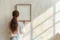 Woman hanging blank frame on light wall in bedroom. Generative AI