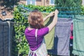 Woman hanging her laundry in garden Royalty Free Stock Photo