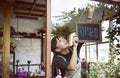 Woman hanging an open sign