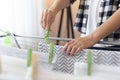 Woman hanging wet clothes with clothespins Royalty Free Stock Photo