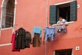 Woman hangs clothes