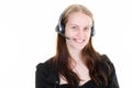 Woman happy in call center tele phone marketer looking direct camera isolated on white background Royalty Free Stock Photo