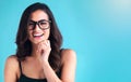 Woman, happy and fashion with glasses on blue background with trendy optometry vision for eyesight. Closeup, portrait Royalty Free Stock Photo